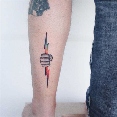 Hand with a lightning bolt tattoo - Tattoogrid.net