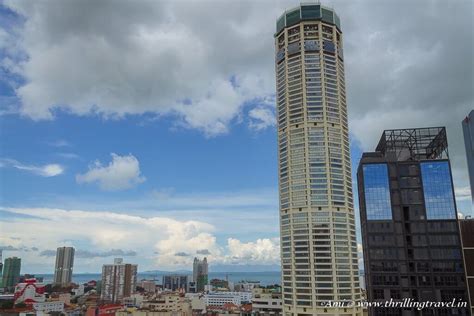 Walking on glass at Rainbow Skywalk in Komtar Penang - Thrilling Travel