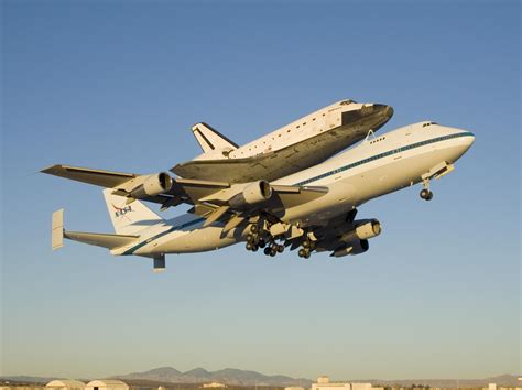 LAMINATED POSTER The modified Boeing 747 carrier aircraft carrying the ...