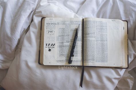 Pen on an open bible — Photo — Lightstock