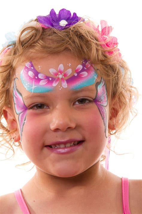 Fairy face paint designs - rainbow, flowers and wings design #facepaint, #fairyparty # ...