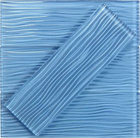 a blue glass tile with wavy lines on it