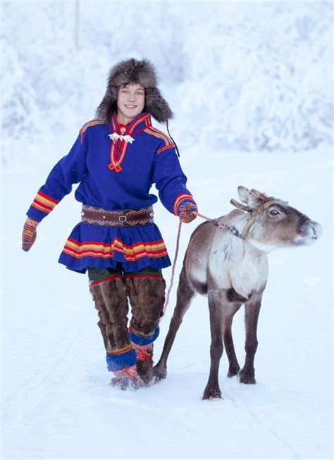 The young man with his reindeer is wearing a Sami costume from ...