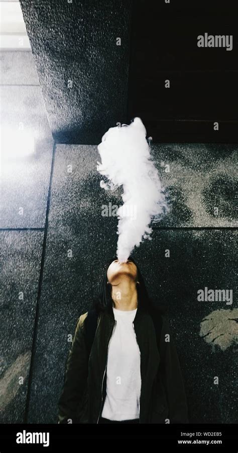 Blowing smoke hi-res stock photography and images - Alamy