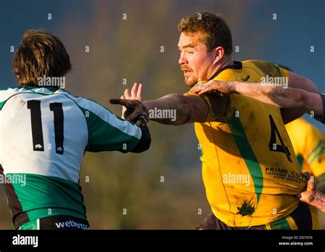 Rugby, player being tackled Stock Photo - Alamy