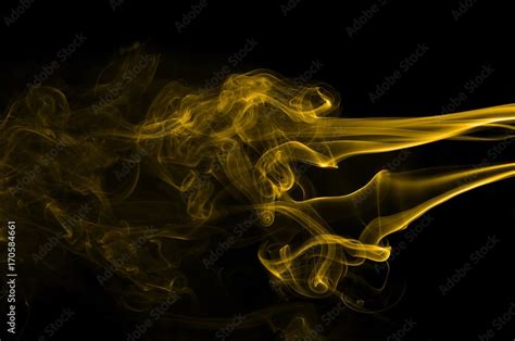 Gold smoke on black background,movement of gold smoke, Abstract gold smoke on black background ...