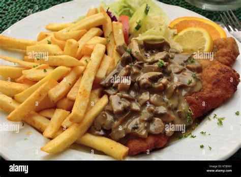 Schnitzel with mushroom sauce Stock Photo - Alamy