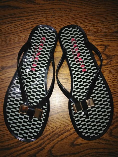 COACH FLIP-FLOP STYLE SANDALS SIZE 7B. JELLY/PLASTIC MATERIAL. BLACK AND WHITE IN COLOR WITH ...