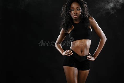 Sporty Fit Black Skin Woman, Athlete Makes Fitness Exercising on Dark Background. Stock Photo ...