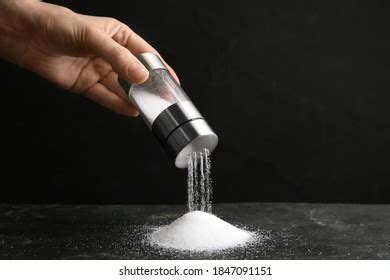 Woman Pouring Salt Shaker Onto Black Stock Photo 1847091151 | Shutterstock