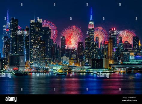 NYC Fireworks Celebration - New York City skyline with the Macy's Stock ...