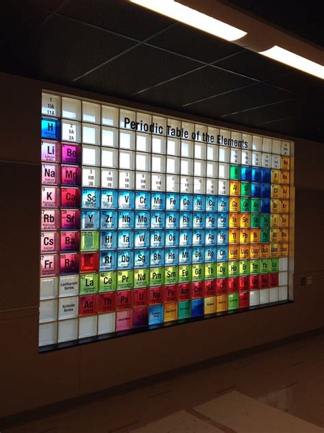 a large colorful display in the middle of a room with lots of glass blocks on it