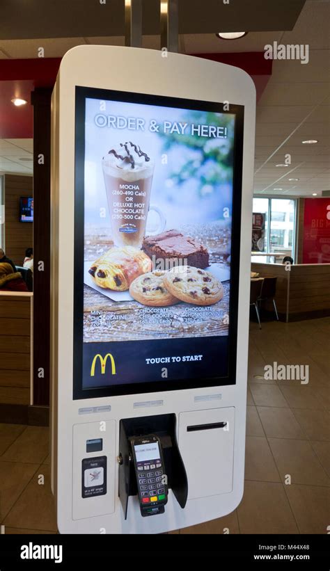 Self-serve order kiosk at McDonald's restaurant in Metro Vancouver, BC,Canada. Self-serve kiosks ...