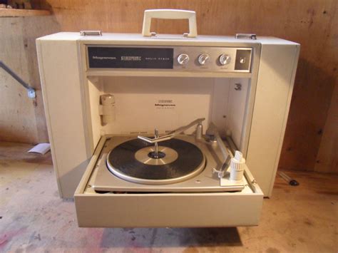 My family had a portable stereo record player very similar to this one. The turntable folded up ...