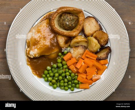 Traditional Sunday Roast Lunch or Dinner of Roast Chicken With Yorkshire Pudding and Stuffing ...