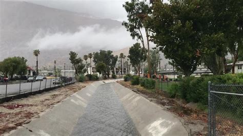 Water flows through the Riverside County Flood Control Channel in Palm ...