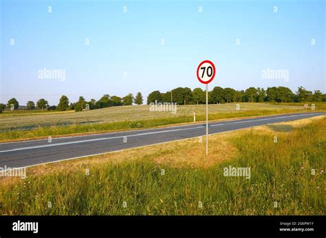 Speed limit sign by a countryside road, Poland Stock Photo - Alamy