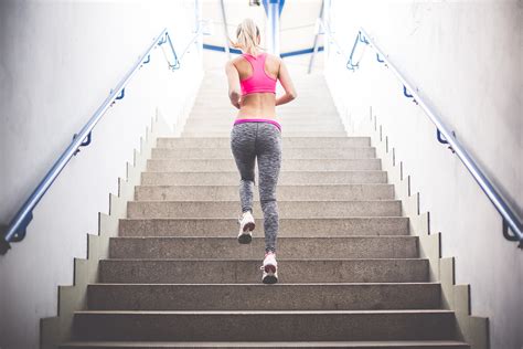 Sporty Woman Running On The Stairs