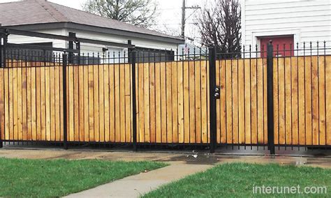 Metal fence with wood combination picture | Fence design, Privacy fence ...