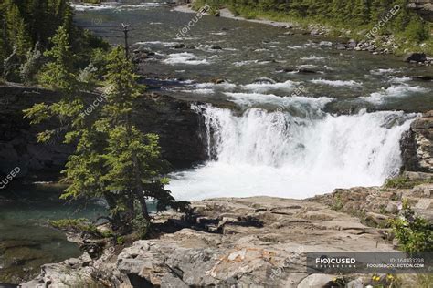 Waterfalls And A Rock Ledge — horizontal, waterway - Stock Photo ...