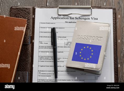 Application form, pen and European Union passport Stock Photo - Alamy