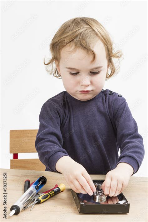 little girl repairing computer parts Stock Photo | Adobe Stock