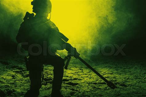 Army sniper in the fire and smoke | Stock image | Colourbox