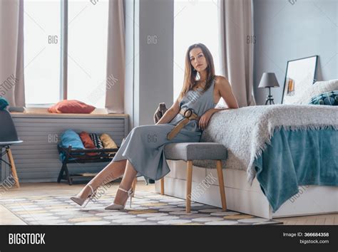 Woman Sitting On Sofa Image & Photo (Free Trial) | Bigstock