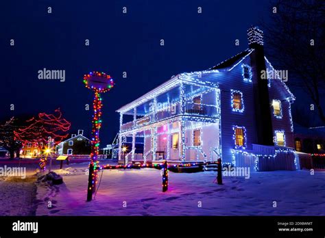 Heritage buildings, trees and fences decorated with Christmas lights at ...