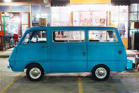 "Adorable Vintage Blue Mini Van For Sale" by Stocksy Contributor "Nemanja Glumac" - Stocksy