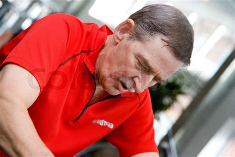 Elderly man in a fitness center | Stock image | Colourbox