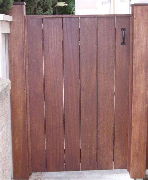 Simple gate with open boards and post caps | Wood gate, Outdoor gate, Yard gate