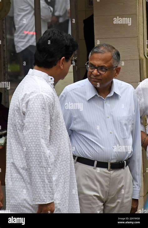 Tata sons chairman Natarajan Chandrasekaran (R) is seen standing ...