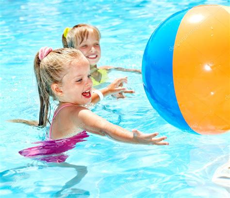 Children swimming in pool. Stock Photo by ©poznyakov 10519114