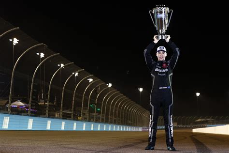 Portraits of a champion: 2021 title winners with their trophies | NASCAR