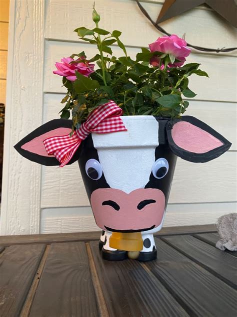 Cow made out of Clay Pots | Diy flower pots, Flower pot crafts ...