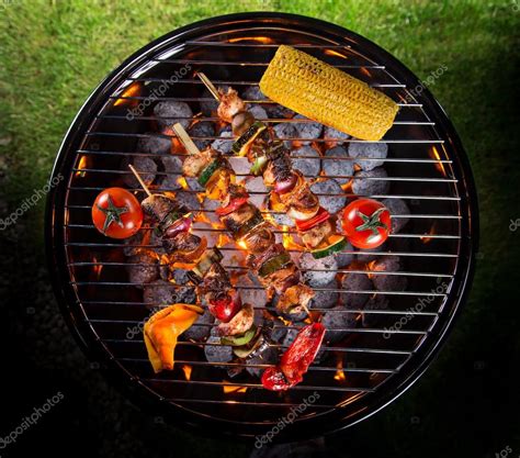 Barbecue grill with various kinds of meat. Stock Photo by ©Kesu01 102675910