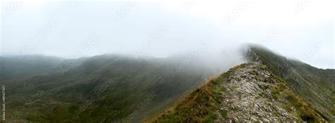 Striding edge, Helvellyn shrouded in morning mist Stock Photo | Adobe Stock