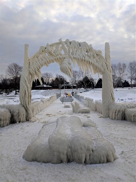 Frozen pier on Euclid Beach, Lake Erie. : r/pics