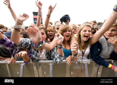 Crowd in front row screaming at a music concert Stock Photo - Alamy