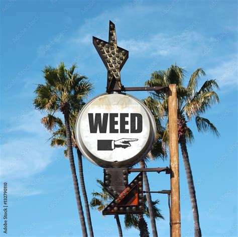 aged and worn vintage photo of weed sign with palm trees Stock Photo ...