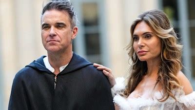 Robbie Williams' daughter Teddy seen for first time at Princess Eugenie's wedding – and she's ...