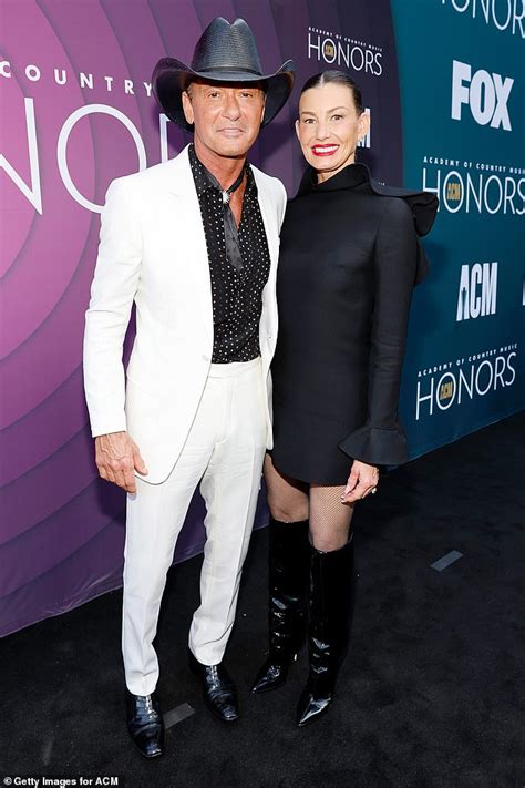 Tim McGraw oozes cool in white suit alongside wife Faith Hill in black ...