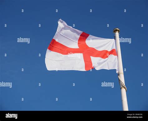 The saint georges flag with the union jack flying hi-res stock ...