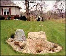 Decorative septic tank covers. Believe it or not, the large light colored rock is a plastic ...