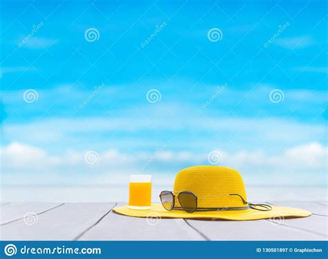 Yellow Hat with Fresh Orange Juice on the Beach. Stock Image - Image of beautiful, freedom ...