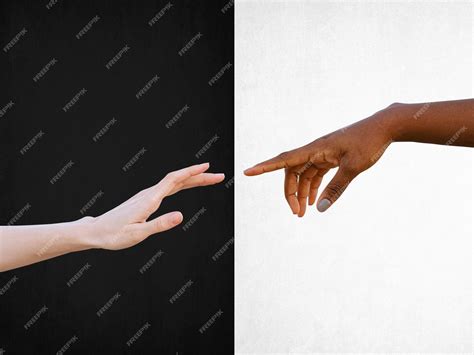 Premium Photo | Black and white human hands reaching towards each other