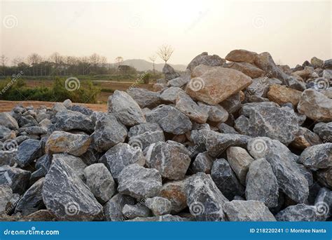 Piles of Gravel Limestone Rocks on Construction Site. Break Stones. Stock Image - Image of ...