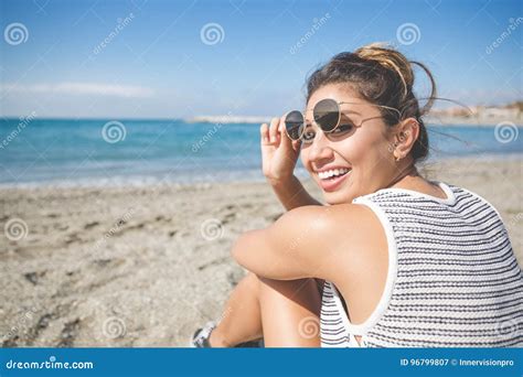 Pretty Young Woman Sitting on Beach Laughing Stock Image - Image of looking, laughing: 96799807