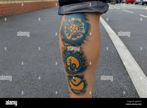 Leeds United fan sporting his club tattoo’s Stock Photo - Alamy